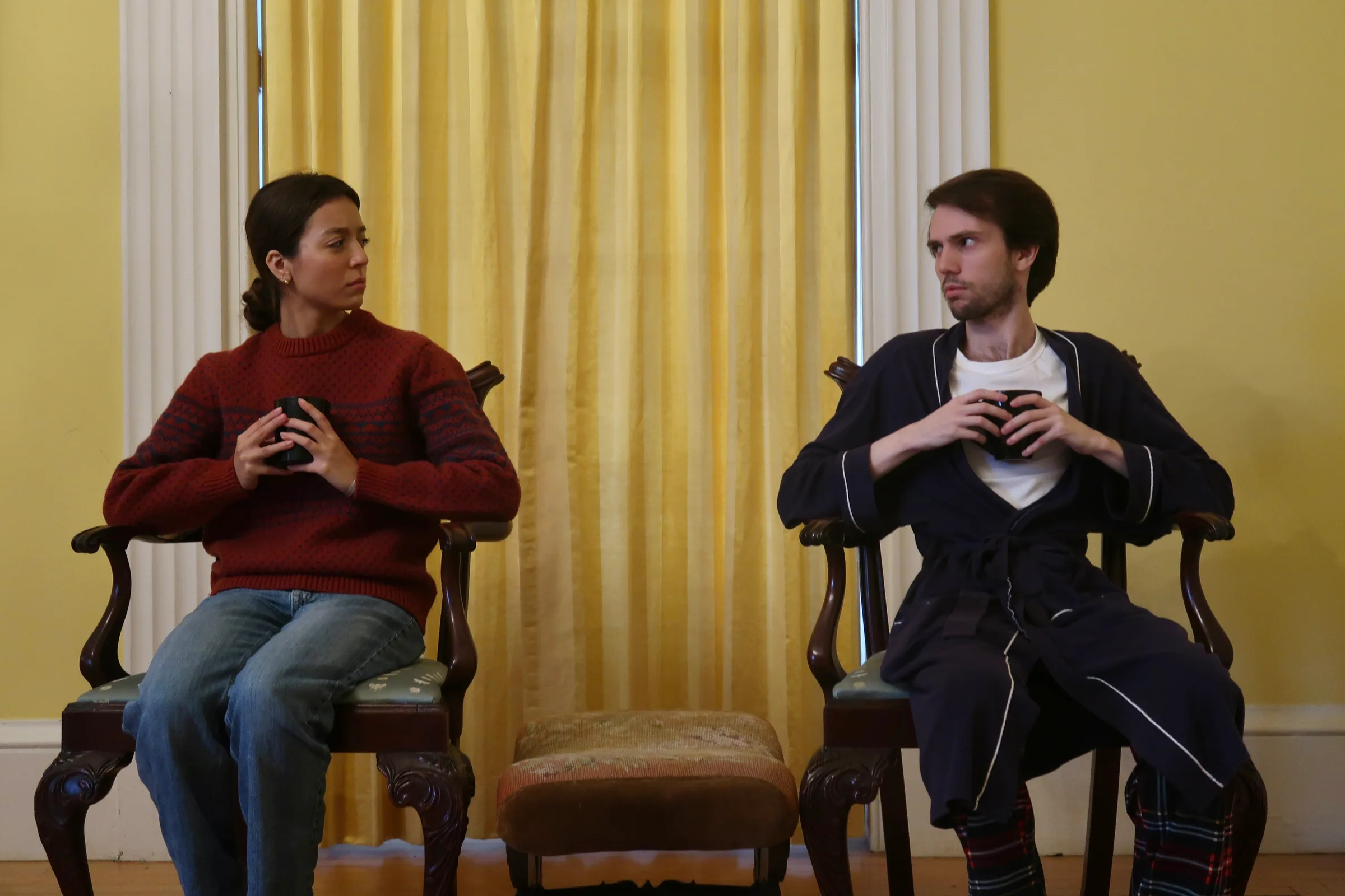 Vanya and Sonia (Mason White and Nora Moukhliss) glare at each other while debating who has had a harder life. Photo by Molly Johnson