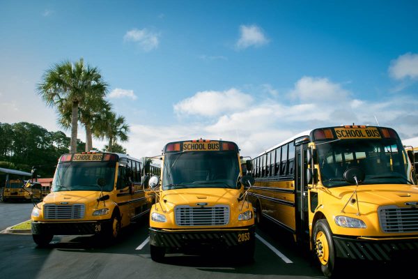 st johns county school buses under a blue sky