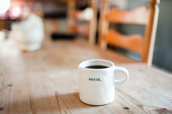 Growers Alliance Coffee Shop - Begin Each day with coffee Mug on table