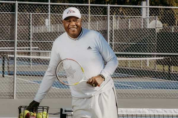 st augustine tennis instructor harold hardy gets ready to serve