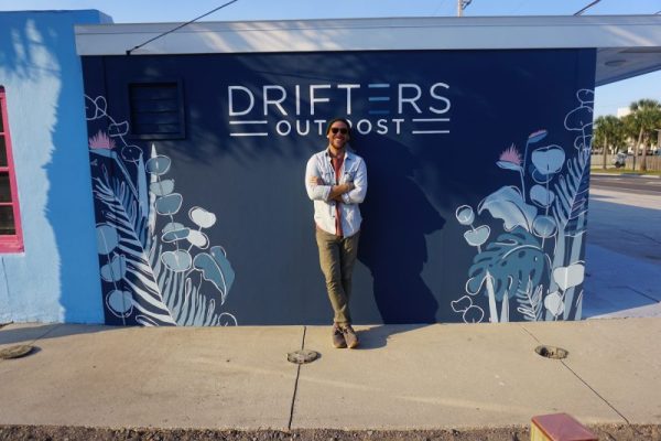 Drifters Owner Ian Guthrie stands in front of Drifters workshop where he fixes bikes in his fleet.