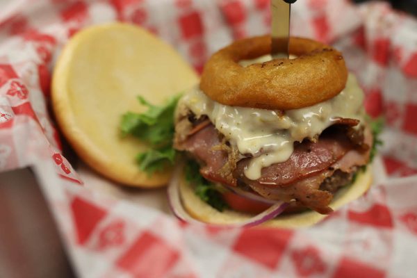 an onion ring-topped burger at burger buckets in st augustine